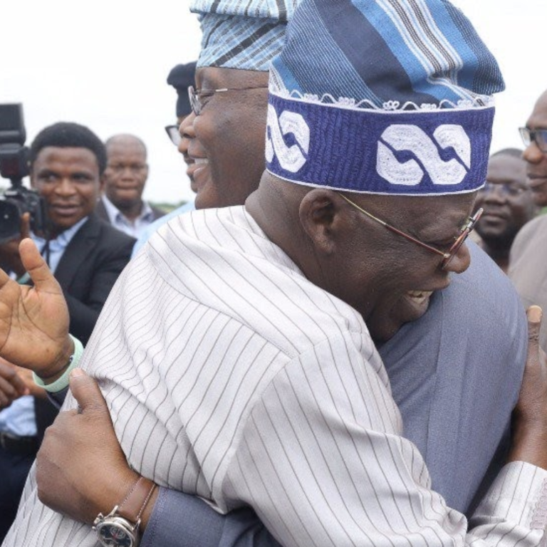 Image of Tinubu and Atiku hugging each other.